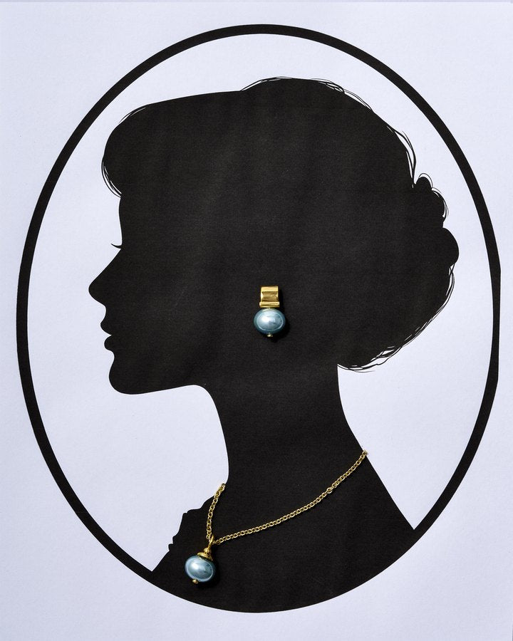 Cameo silhouette wearing an aqua pearl earring and aqua pearl pendant